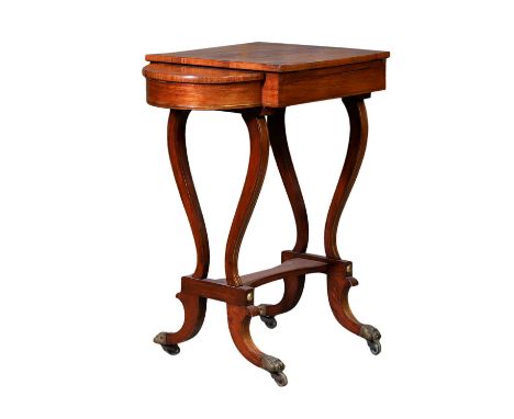 A Regency rosewood and brass inlaid games table, with a hinged top, lacking rest, pulling out to reveal a backgammon board, t