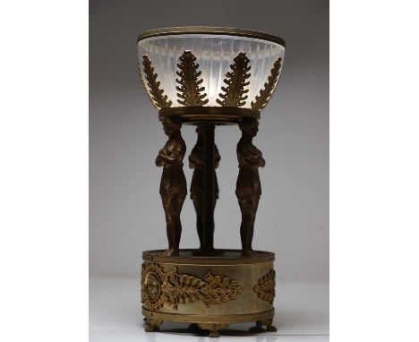 A French Empire style bronze tazza, 19th century, with cut glass bowl within a stiff leaf bowl, over three figural supports,4