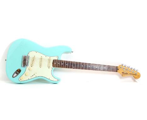 A Fender Stratocaster style electric guitar, of conventional form, in nitro-cellulose sea foam green finishCondition ReportLi
