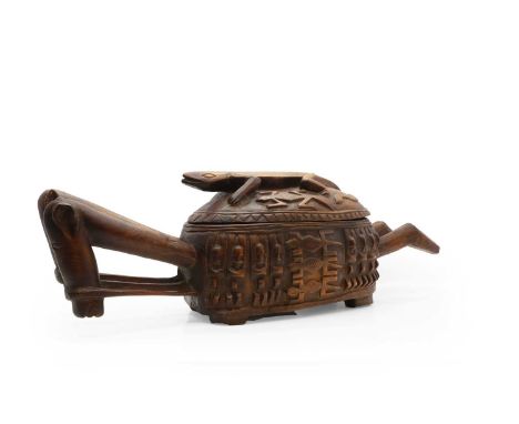 A hardwood Aduno Koro Dogon, Mali, African, in the form of a horse, the sides carved with eight figures, the lid with a carve