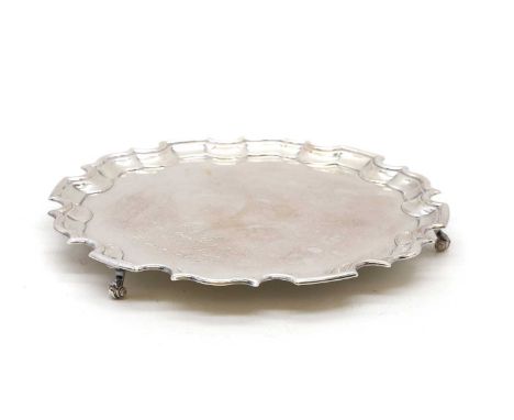 A silver salver, London, 1993, with an engraved inscription, 30.5cm diameter, 28oztCondition ReportFair overall.