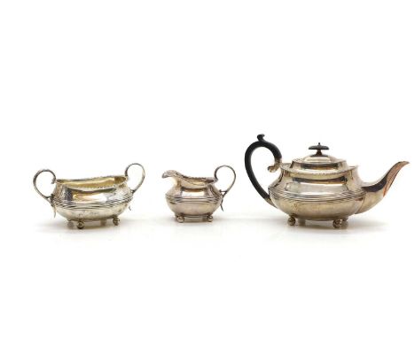 A silver three piece tea set, by William Hutton and Sons, Sheffield, 1914 and 1915, 14.8cm teapot, 36ozt overallCondition Rep