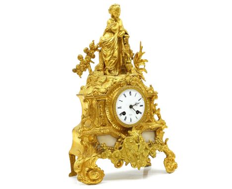 A gilt metal and marble mantel clock, 19th century, by Henry Marc of Paris, the two-train movement striking on a bell, surmou