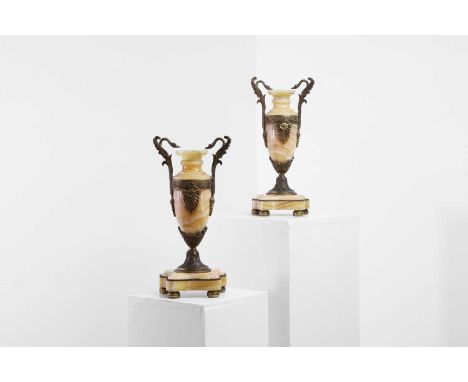A pair of Empire-style onyx and gilt-metal-mounted cassolettes, 19th century, French, each with swan-neck scroll handles and 