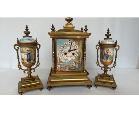 19th-century French three-piece garniture clock set, gilt brass with hand-painted porcelain panels depicting rural scenes. El