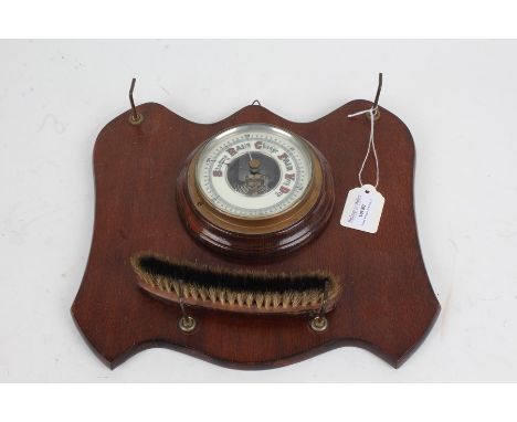 Edwardian mahogany wall hanging brush rack, with central barometer, curved brush and hooks for a further two brushes, 29cm wi