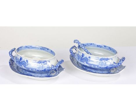 Two Spode blue and white sauce tureens and stands, together with a ladle, transfer decorated with a landscape scene (5)