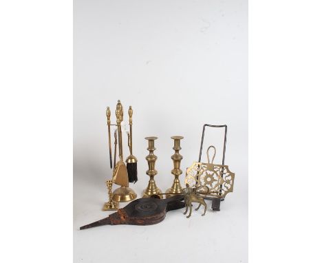Fireside accessories to include brass and steel sliding trivet, four piece companion set and stand, pair of brass candlestick