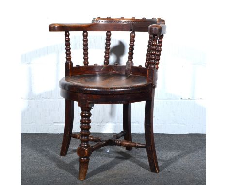 Oak hoop-back chair, bobbin turned spindle, circular dished seat, splayed leg joined by rails, width 63cms, height 76cms.