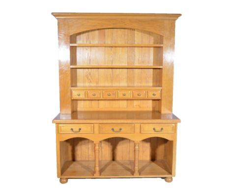 Modern oak dresser, three shelf back with six spice drawers, above a moulded rectangular top, with three frieze drawers above