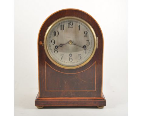 Edwardian mahogany stained walnut mantel clock, arched case, bun feet, silvered dial.