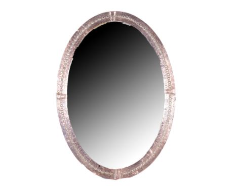 Arts & Crafts style oval wall mirror, beaten copper, 80cm x 60cm.