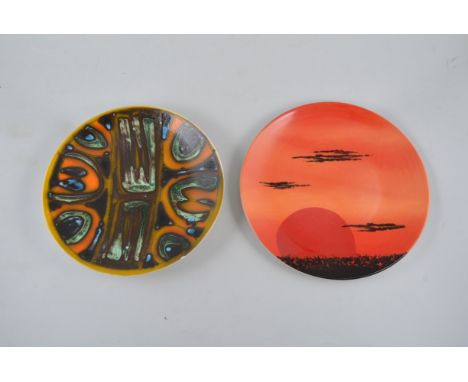 Poole Pottery plate, African Sky, diameter 28cm and a Poole Delphis plate, (2).