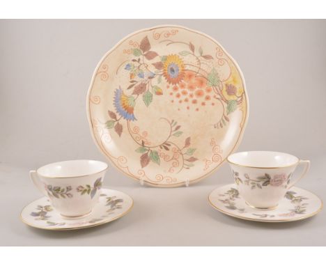 Susie Cooper part tea service, yellow and pink flowers,stamped "Bone China England" comprising six side plates, six saucers, 