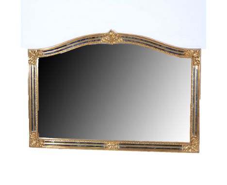 Contemporary over mantel mirror, Venetian style with an arched plate, scrolled corners, width 127cm, height 88cm.
