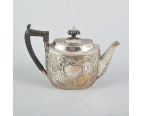 A Victorian Scottish oval silver teapot, repousse chased with floral and foliate decoration, vacant cartouche, ebony handle a