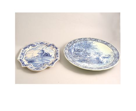 Boch M R L Delft ware charger, printed with a stag hunt, 39cm, another Delft charger painted with a canal and windmill scene,