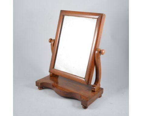 Victorian mahogany toilet mirror, rectangular plate, serpentine platform, 36cm; and four other mirrors. (5)