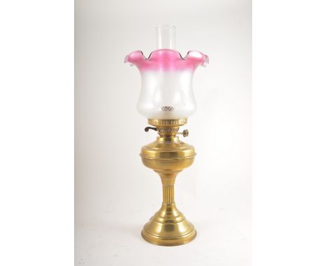 Brass oil lamp, tinted and frosted shade, 55cm.