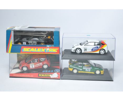 Scalextric slot car issues comprising Citroen C2 JWRC, Ford Escort BP, Ford Focus WRC no.31 plus TVR Speed 12 Works. All appe