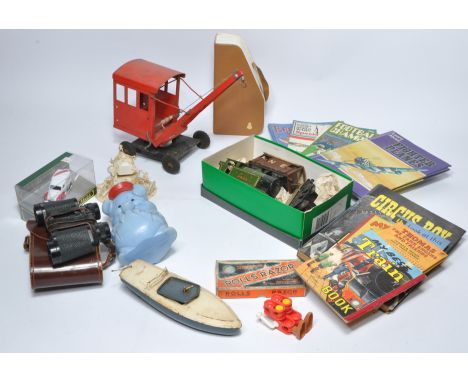 A misc assortment of vintage children's toys and books as shown in addition to other vintage items including razor, binocular