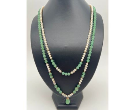 A double row pearl and green jade bead necklace with jade drop, gold tone metal spacer beads and push clasp. Total length inc