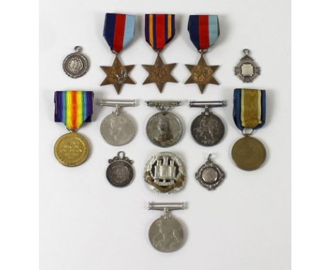 A group of medals comprising WWI Service and Victory medals awarded to WWI Pte D Daniels, 7933,  E Yorks Regiment, and five W