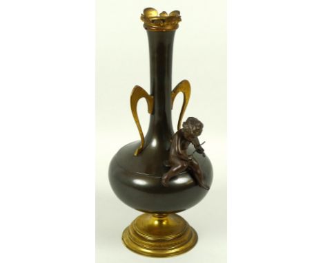 A gilt brass two handled vase, the body decorated with small bronze figure of a cherub playing the violin, marked Kayser to b