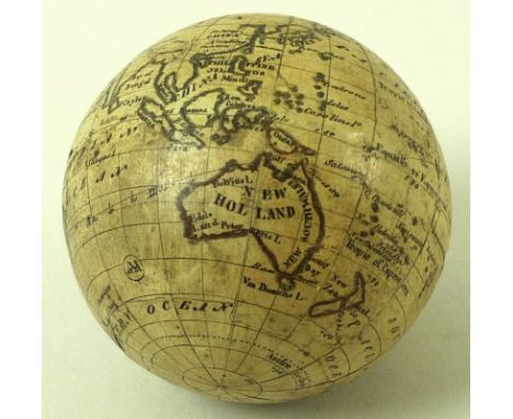 An early 19th century miniature terrestrial globe with mark for Carl Bauer, with Australia labelled as New Holland, 6.5cm dia