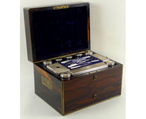 A 19th century coromandel dressing table box with Bramah lock and key, solid silver fittings, trinket boxes and perfume bottl