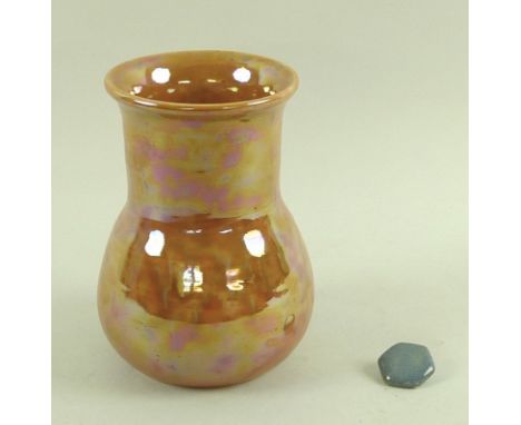 A Ruskin orange lustre vase, stamped to base, 11 by 15.5cm, together with a single hexagonal blue ceramic button, stamped Rus