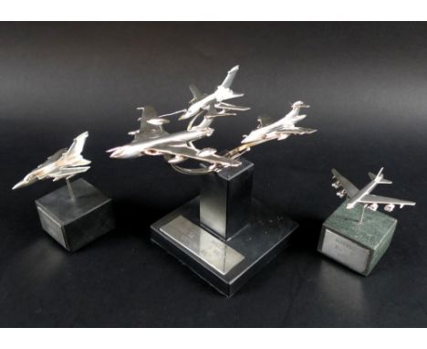 A group of three sterling silver models of airplanes, the larger displaying a Victor K Mk 2 refueling a Tornado ADV F2 and a 