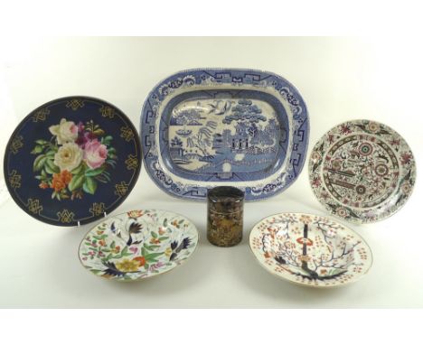 A selection of mostly English 19th century ceramics including a floral painted charger with navy blue ground and geometric gi