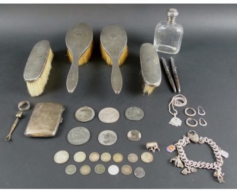 A selection of silver including a charm bracelet with six charms, a ring, a poppy necklace set with moonstone, an engine turn