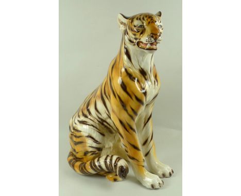 A near life size Italian ceramic model of a snarling tiger, base incised Italy, possibly by Casa Fina, 50 by 75cm high.