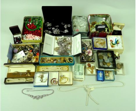 A group of vintage costume jewellery including various cut glass drops, vintage paste, coins and banknotes, a French jet broo