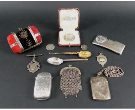 A group of silver items including two vesta cases, one converted to a petrol lighter, the other with silver Albert attached, 