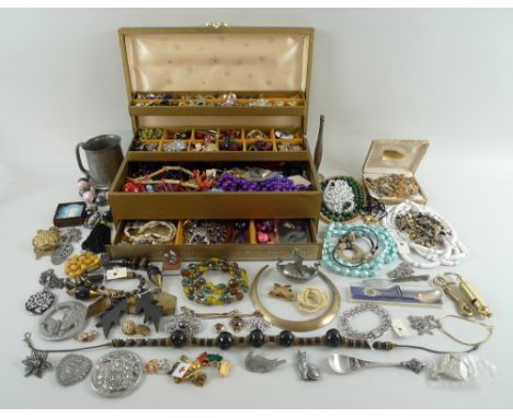 A large collection of costume jewellery including an Esser of Canada faux amber pear pendant, jet necklace, apple jewellery, 