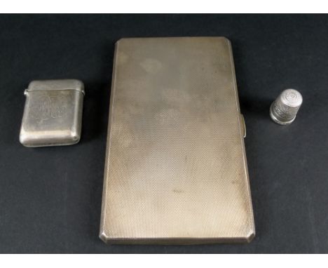 A silver cigarette case, with engine turned decoration, Birmingham 1964, Russells Ltd, together with a silver vesta case, Che