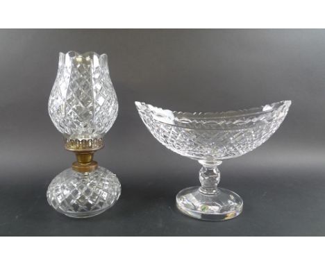 A Waterford Crystal pedestal boat bowl, 23 by 33cm, with certificate, number 292/555, and a Waterford Crystal hurricane table