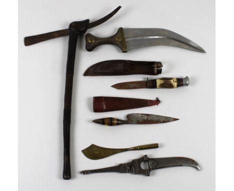 A group of bladed items, comprising a Trench Art letter opener commemorating the battle of Messines 1917, a steel curved blad