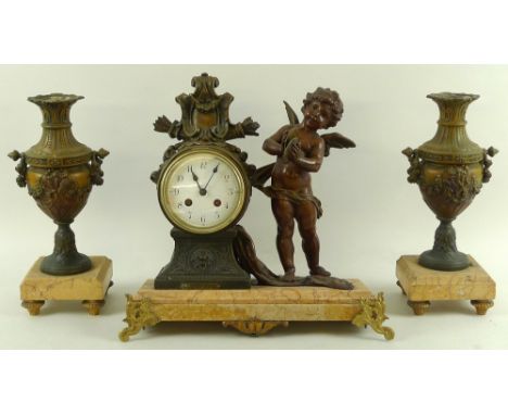 Attrib. L and F Moreau (French, 1855-1919 and 1857-1930): A clock garniture, the Rococo style clock body with two flaming tor