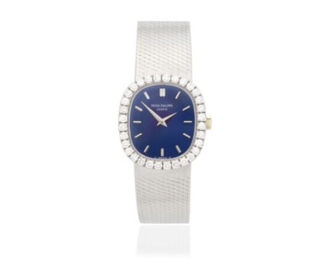 Patek Philippe. A lady's 18K white gold diamond set manual wind bracelet watch with sigma dialModel: EllipseReference: 4134/4