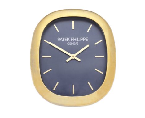 Patek Philippe by Inducta. A gilt metal quartz wall clockModel: EllipseDate: Circa 1980Movement: Jewelled quartzDial: Blue, a