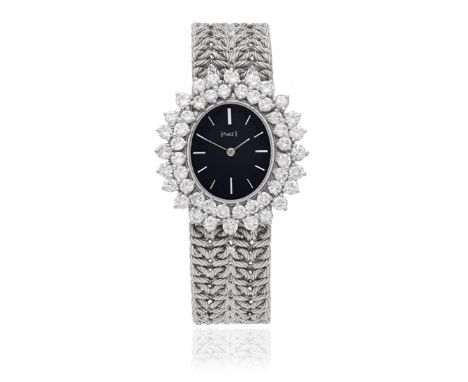 Piaget. A lady's 18K white gold diamond set manual wind bracelet watchReference: 9350 N19Date: Birmingham Import mark for 197