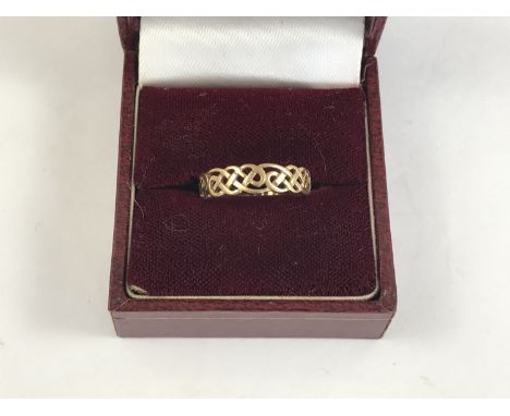 A 9ct gold Celtic influence dress ring, having a plaited openwork face, 1.2g