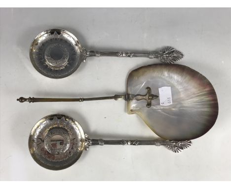 A pair of late 19th century Egyptianate electroplate servers, and an electroplate-handled shell ladle