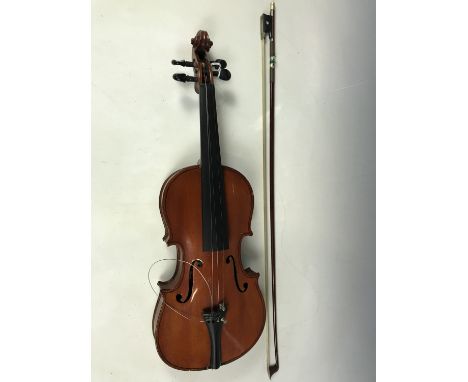 A late 19th / early 20th Century violin and bow, the former having two-piece back (13 inches excluding button) and bearing a 