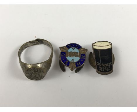 A Guinness enamel lapel badge, a Trade Union badge and novelty birth sign finger ring