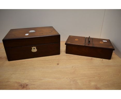 A Victorian mahogany sewing box, having a vacant Mother of Pearl cartouche to the lid and opening out to a tooled interior wi